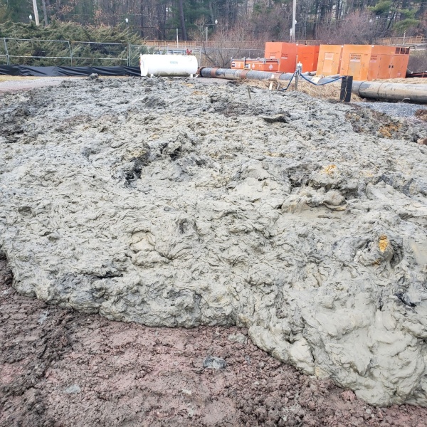 Sediment dewatering stockpile